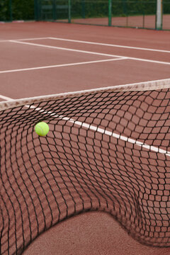 Ball hitting the tennis net