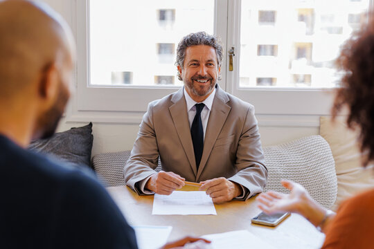 Financial advisor consulting clients about financial planning
