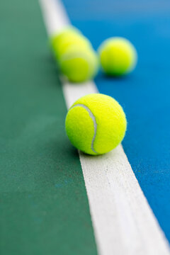 Multiple Tennis Balls on Court with Shallow Depth of Field