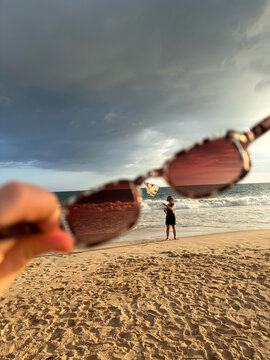 Tropical Beach Framed Through Sunglasses