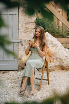 Woman enjoying refreshing summer drink on a relaxed holiday