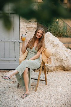 Woman enjoying summer holiday with refreshing drink