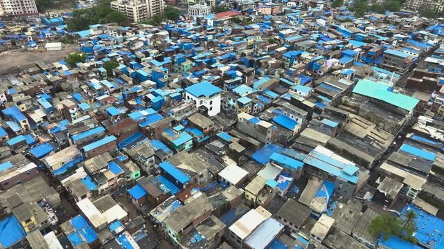 Urban development contrast in Mumbai city drone shot Mumbai cityscape showing slum and high rise buildings aerial view