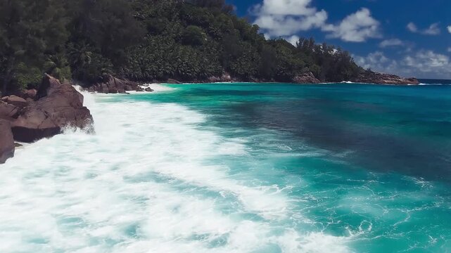 Vacation travel holidays and recreation on beach concept. Tropical beach with sea and palm taken from drone. Praslin island, Seychelles. Slow motion