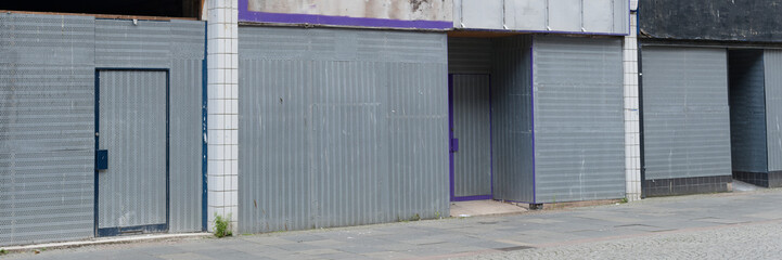 Office window shutters closed due to business closure