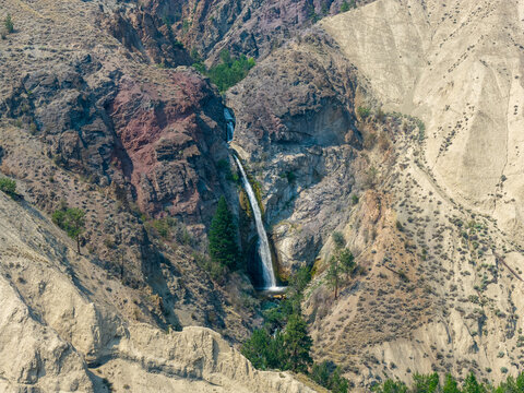 Waterfall Cascading Through Rugged Canyon Cliffs on the Thompson River Near Spences Bridge, British Columbia, Canada