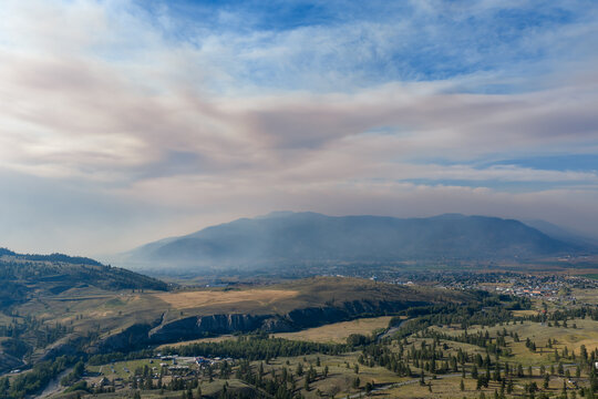 Misty Mountain Valley With Forest Fire Smoke Over Merritt, British Columbia, Canada At Dusk