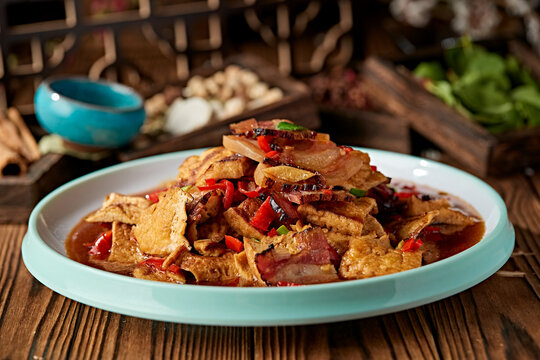 Stir-fried tofu with fresh chopped chili peppers and sliced Xiangxi cured pork