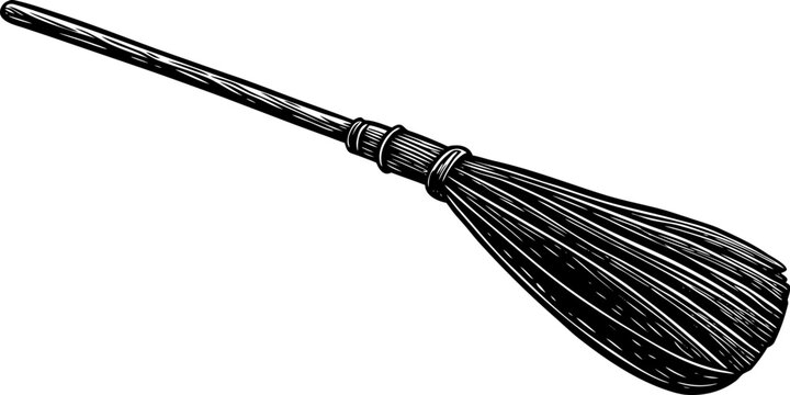 A weathered wooden broomstick, diagonally positioned across the frame. The broom's handle is a light brown, gradually darkening towards the head, showing textured wood grain. The bristles, made of str