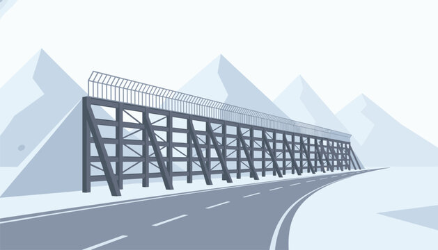Snowy mountain road landscape featuring a large metal crash barrier for winter road safety and traffic control.