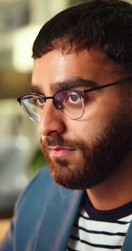 Creative, glasses and business man in office for thinking, reading and ideas for marketing campaign. Night, startup and person with reflection, problem solving and planning for project deadline