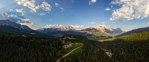 Panoramic view of Dolomites mountain range with pine forest wilderness exploration © Maddi