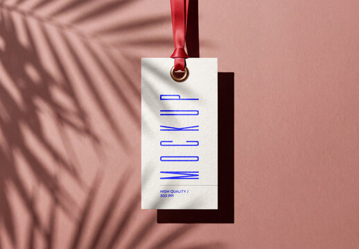 Hang Tag Mockup with Red Ribbon and Palm Shadow on Pink Background