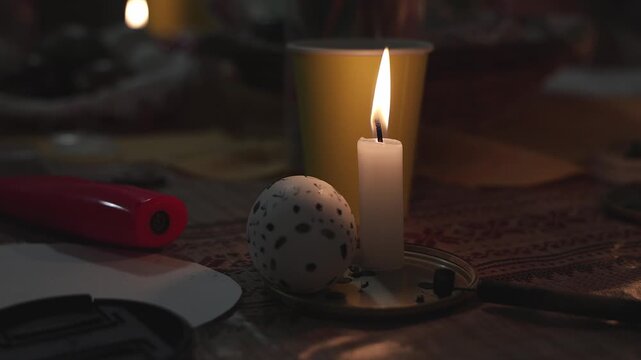Hand Decorating Easter Egg With Wax Candle