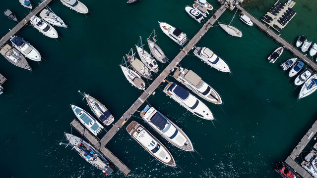 Aerial view of boats in emerald waters of Mediterannean sea, Gozo, Mgar, Malta.