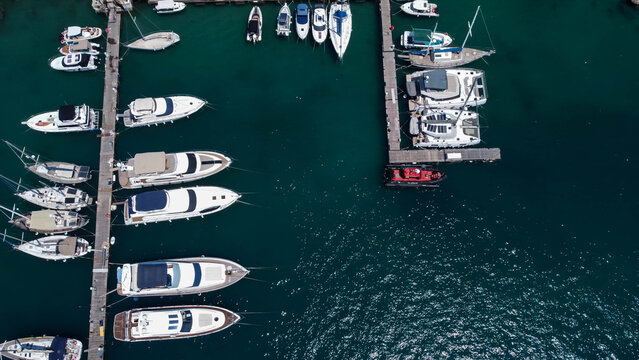 Aerial view of boats in emerald waters of Mediterannean sea, Gozo, Mgar, Malta.