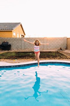 Girl Jumping in Pool