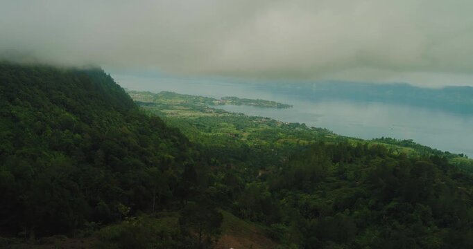 Cinematic Drone Shot of Lake Toba Hills and Natural Scenery