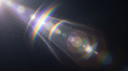 Obraz premium Rainbow light beams shining through a dark space with sparkling particles and lens flares everywhere