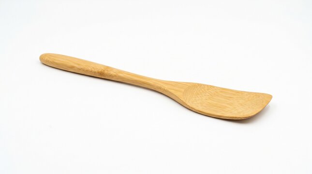 Natural bamboo spatula for sustainable cooking, kitchenware, food preparation and culinary branding. Isolated on White background.