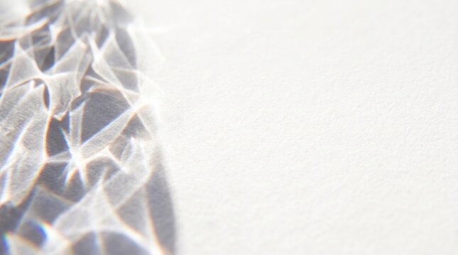 Bright caustic sun rays reflecting on white textured paper background, elegant wedding background, pure sunlight refractive optical pattern texture