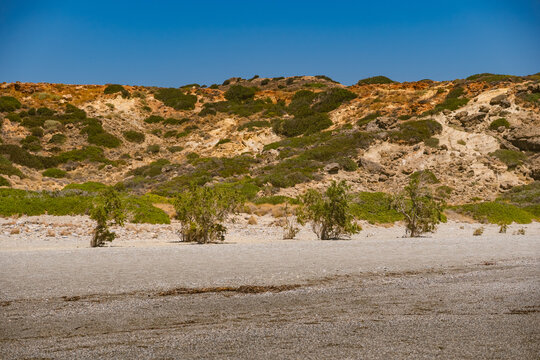 The area around Triopetra Beach, bordered by hills and sparse vegetation.