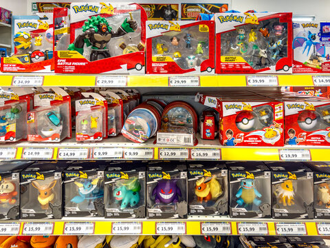 Italy - July 10, 2026:retail store shelf filled with various Pok&eacute;mon merchandise, including Jazwares action figures, Select Vinyl collectibles, battle packs, and Pok&eacute; Balls, 