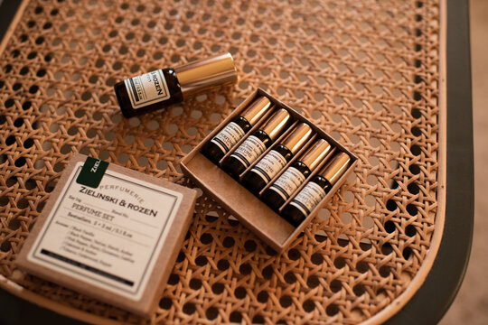 Tel Aviv, Israel 9 of July 2026 - Zielinski Rozen perfume set with mini size and fragrance bottle in 10ml on rattan table close up.