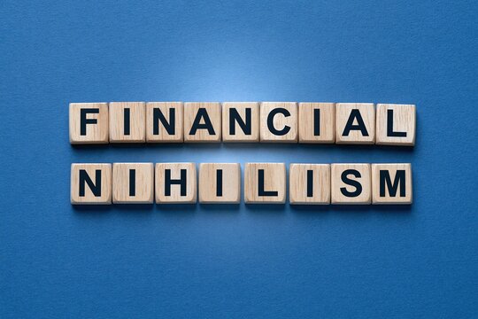 Financial nihilism words constructed with wooden letter tiles on blue background