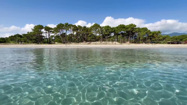 Corsica island France turquoise sea water surface and white sand beach beautiful coast uncontaminated nature near Bastia in Corsica island