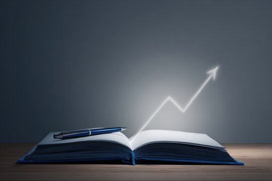 An upward growth arrow shines from an open blue notebook with a pen on a clean desk