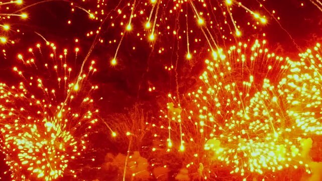 Brilliant fireworks illuminate the dark canvas above during Christmas and New Year celebrations. Explosions of light paint the sky with vibrant colors, creating a mesmerizing display of festive joy.