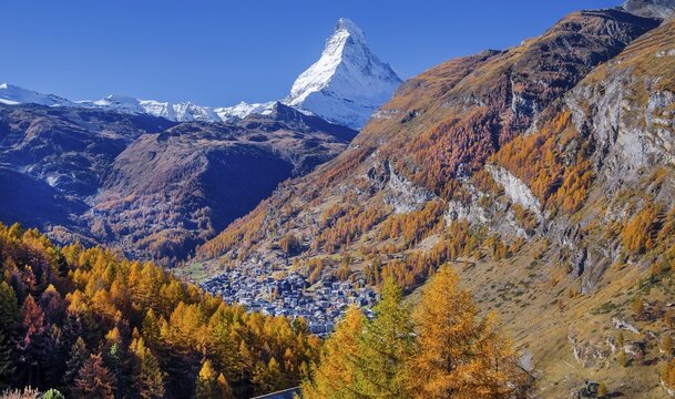 View from the hamlet of Ried down into the valley to the village and the Matterhorn 4478m in autumn, Zermatt, Mattertal, Valais, Switzerland