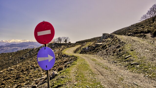 Road signs in front of a fork on a gravel road in the mountains, Lefka Ori, White Mountains, mountain massif, west, Crete, Greece