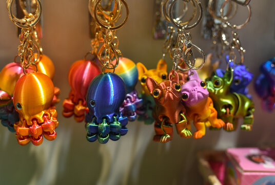 
A collection of various flexible 3D-printed keychains and souvenirs in the shape of animals; a concept of modern additive manufacturing.