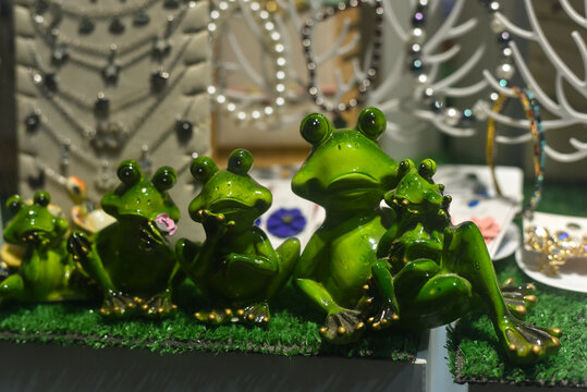 Cute souvenir frogs made of green ceramic