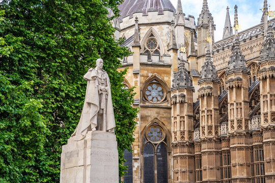 Portland stone statue of King George V by sculptor Sir William Reid Dick, unveiled 1947 by George VI; plinth designed by Sir Giles Gilbert Scott, Old Palace Yard, Abingdon Street, London, UK
