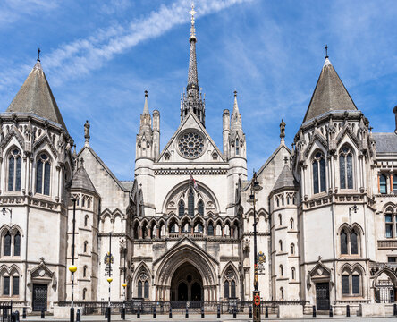 Gothic Revival facade of the Royal Courts of Justice, Strand, designed by George Edmund Street, opened by Queen Victoria in 1882. Portland stone with pointed arches and carved stonework, London UK