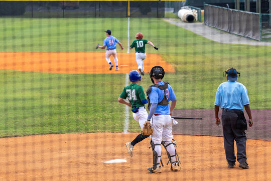 Baseball Player Scores from Third Base while Batter Safely Reaches First base