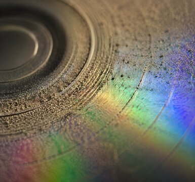Dust Layer Resting Heavily on the Grooves of a Blank CD Macro Lens Iridescent Light
