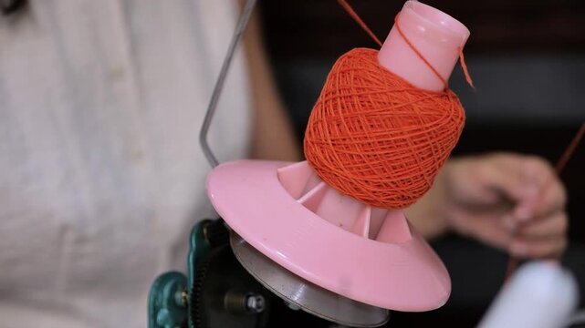 winding a spool of thread