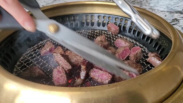 Sizzling Premium Korean Beef (Hanwoo) Grilling to Perfection on a Hot Charcoal Grill