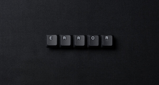 Error word made from keyboard keys on a dark textured surface, representing system failure, bug, troubleshooting, crash, and technology problems.