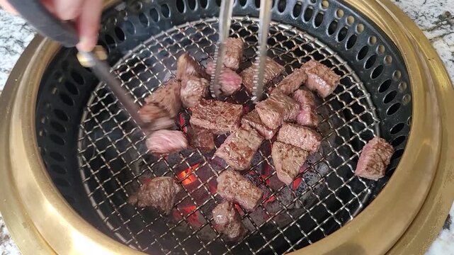 Sizzling Premium Korean Beef (Hanwoo) Grilling to Perfection on a Hot Charcoal Grill