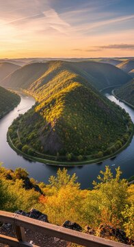 Aerial view of a meandering river in autumn forest landscape.