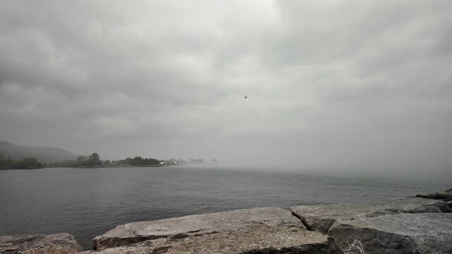  misty fog rising from Lake Ontario's cold depths  at Scarborough Bluffs in Toronto