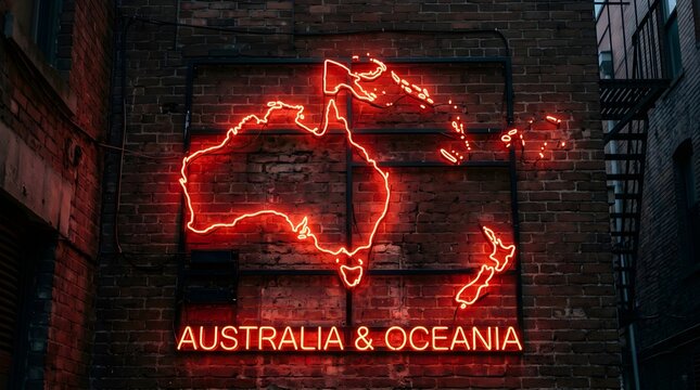 Bright red neon sign depicting the continent of Australia and Oceania mounted firmly upon a textured dark rustic brick wall in an urban alleyway setting tonight