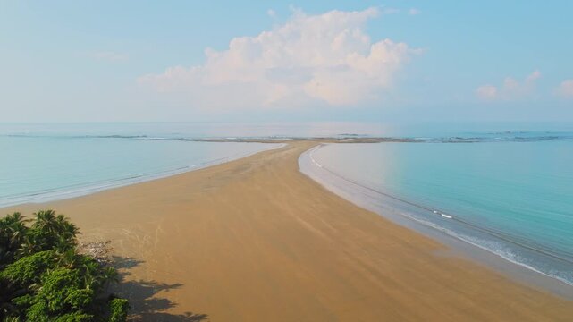 Famous Whale Tail sandbar extends into blue ocean at Marino Ballena National Park Uvita Costa Rica