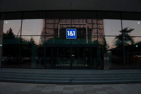 Entrance of the 1&1 office building at dusk on July 11, 2026 in Karlsruhe, Germany.