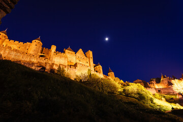 Golden lights illuminate the landscape of the medieval walls © Pete Niesen Photo